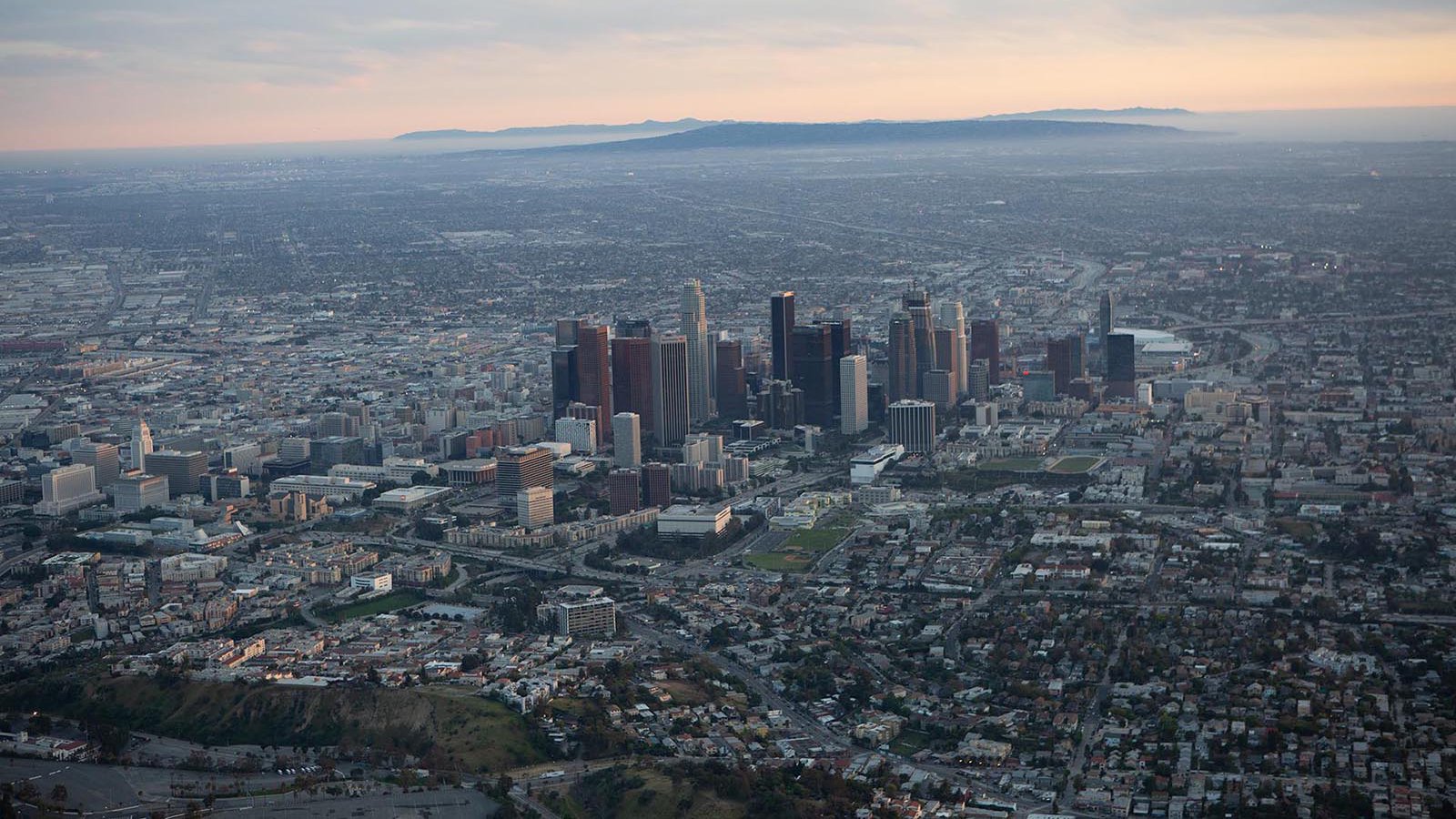 Aerial cityscape of Downtown Los Angeles Skyline at Sunset before any post-production or color-correction