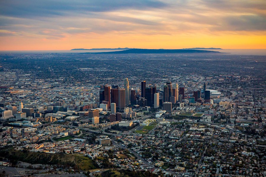 Aerial cityscape of Downtown Los Angeles Skyline at Sunset with Santa Catalina Island in the background