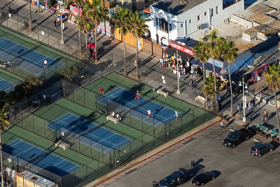 Blog photograph of paddle tennis players during a match at the paddle tennis courts in Venice Beach, California on Christmas Day, 2020.