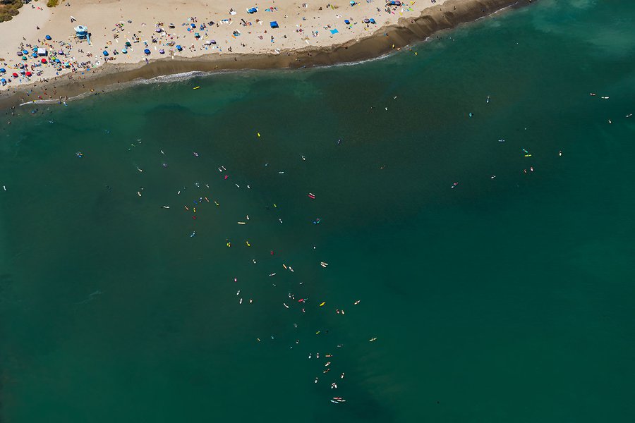 Blog image of beach goers and surfers in Dana Point, California on a hot summer day