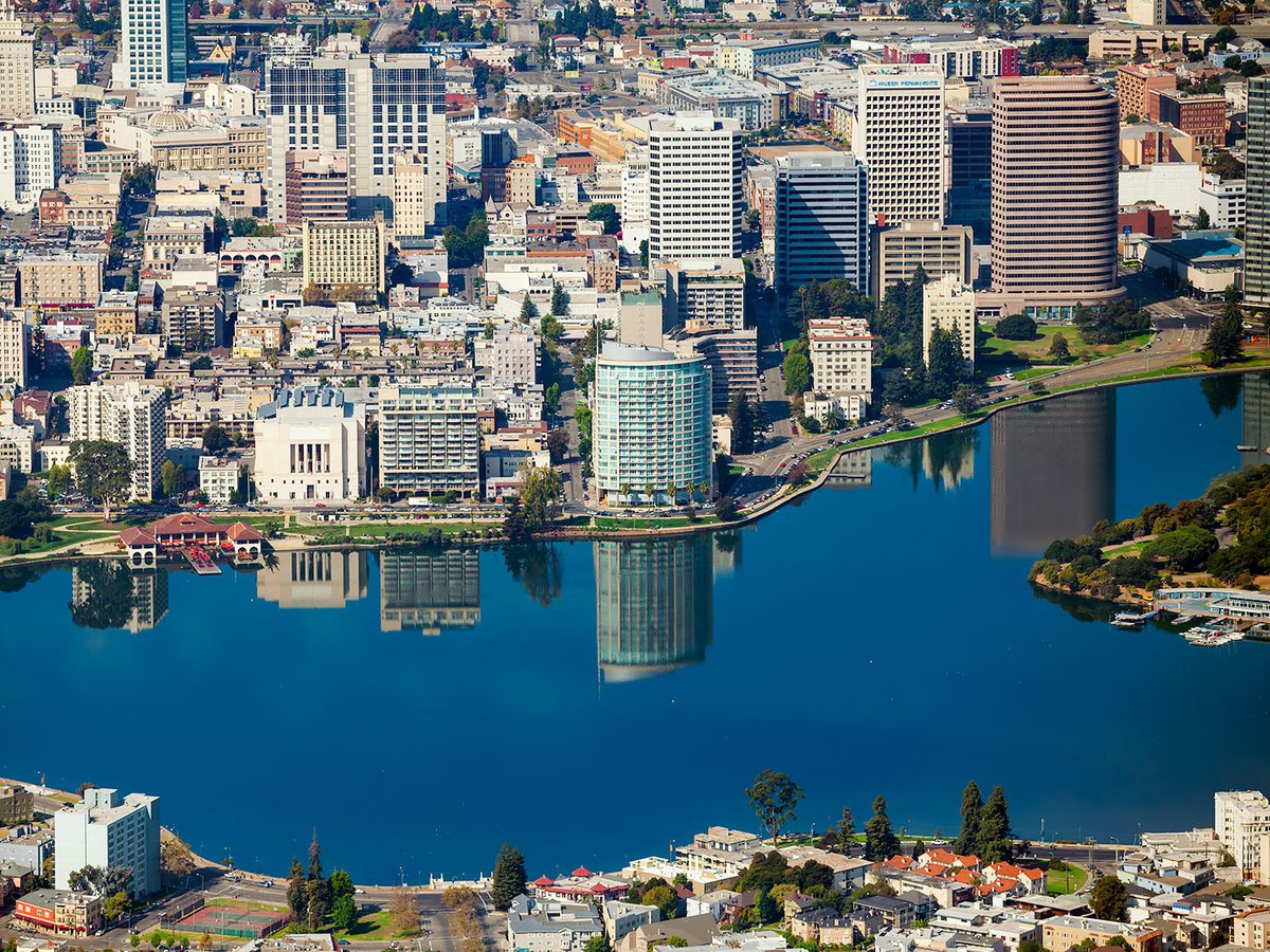 Blog photo of Lake Merrit in Oakland, California, with reflections of the buildings reflecting off the surface of the lake