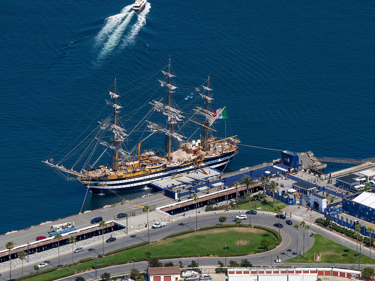 Aerial view of the Amerigo Vespucci docked at the bustling Port of Los Angeles.