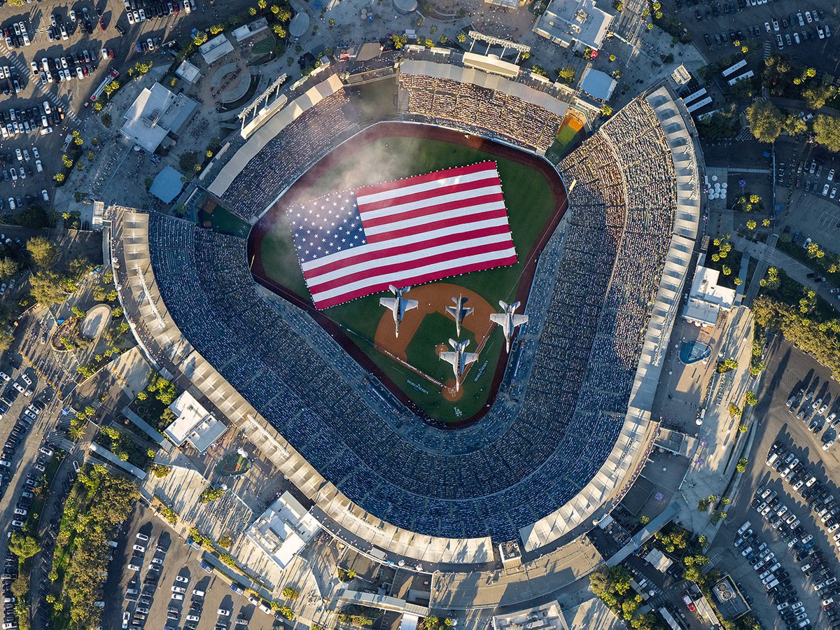 Aerial image of 4 fighter jets flying over Dodger Stadium at the conclusion of the National Anthem, making the beginning of Game 1 of the 2024 World Series