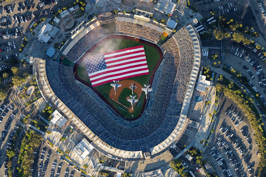 Aerial image of 4 fighter jets flying over Dodger Stadium at the conclusion of the National Anthem, making the beginning of Game 1 of the 2024 World Series