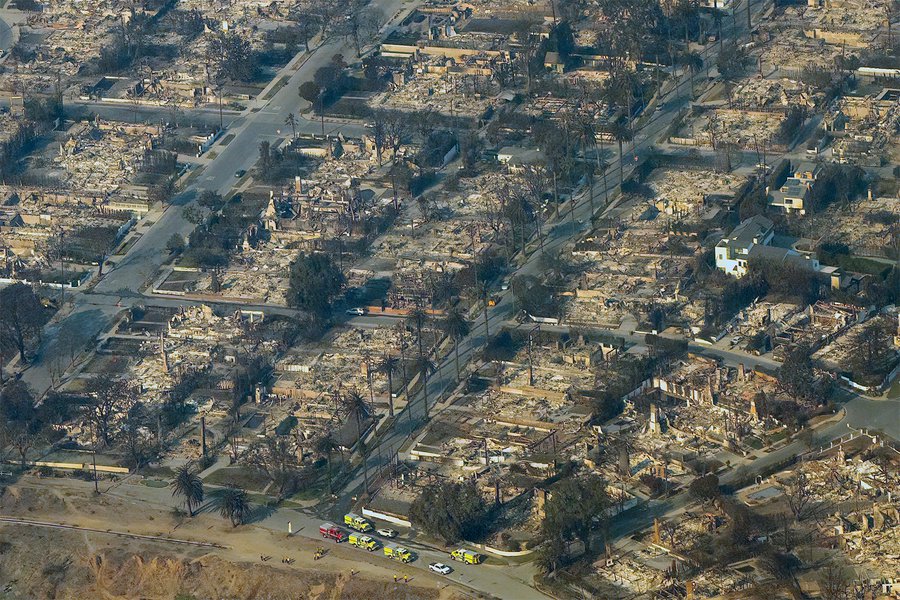 Aerial view of the Palisades Fire aftermath reveals widespread destruction, with charred remains and ash covering a once-thriving Pacific Palisades community.